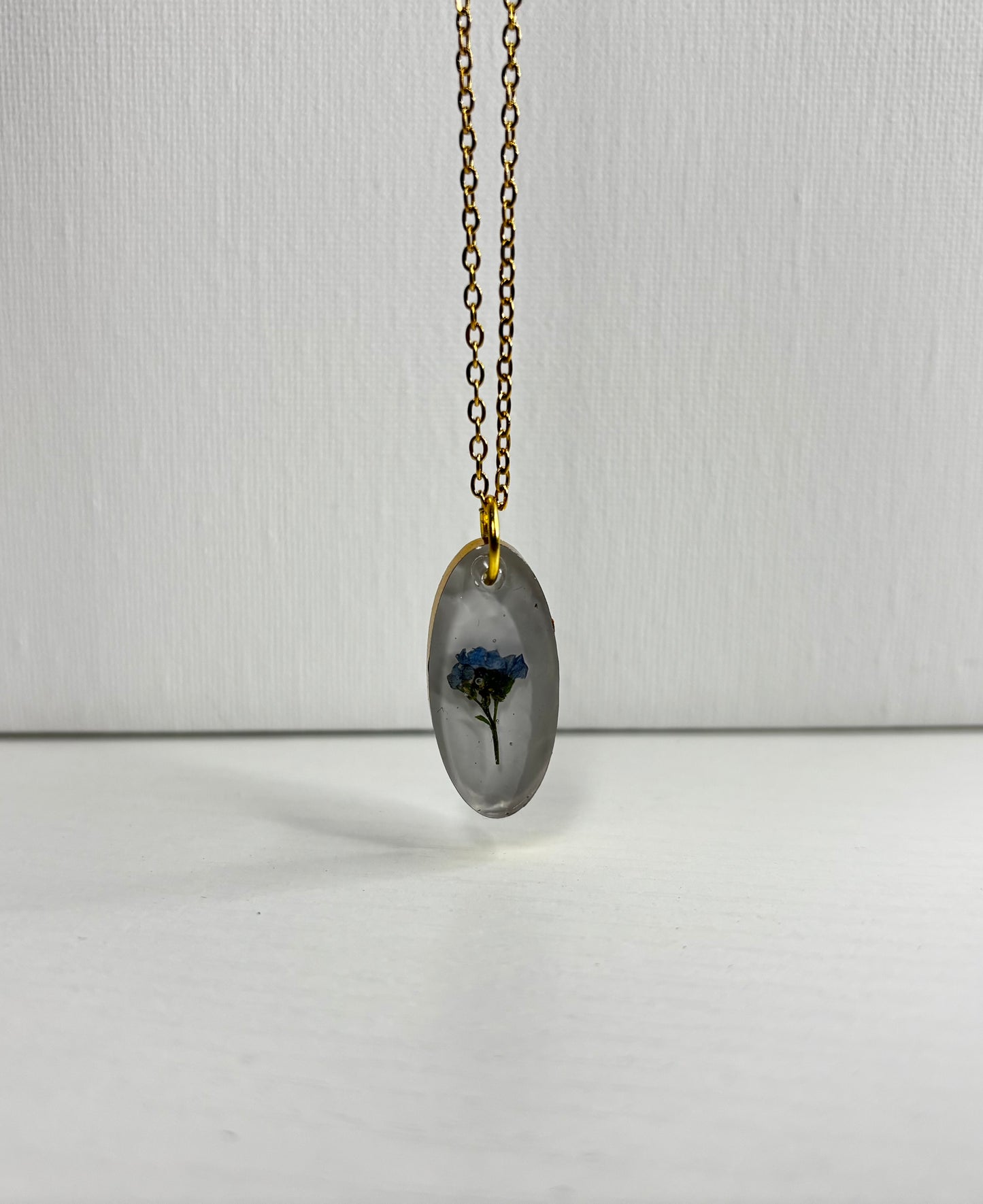Blue and gold oval necklace