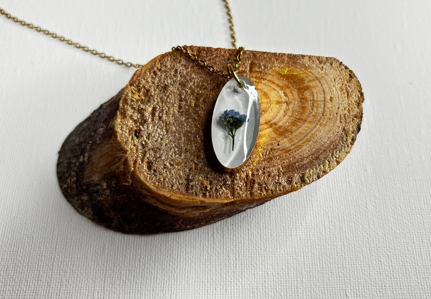 Blue and gold oval necklace